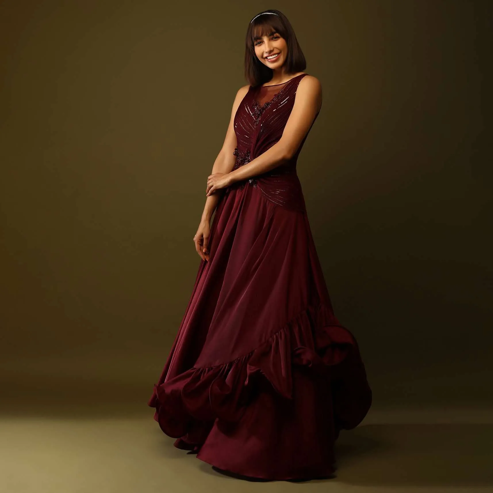 Maroon Gown With Ruched Bodice And Fancy Ruffled Hem